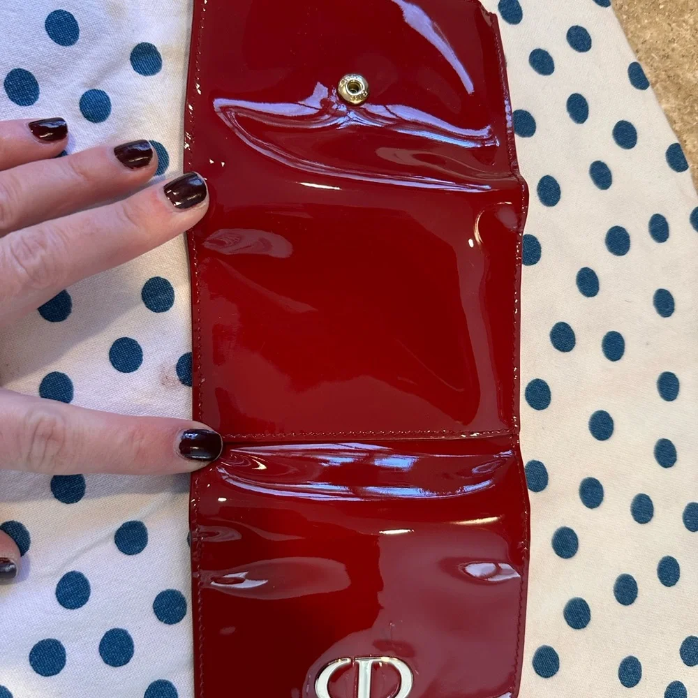 CHRISTIAN DIOR cherry patent leather wallet / card holder. Gold accents.